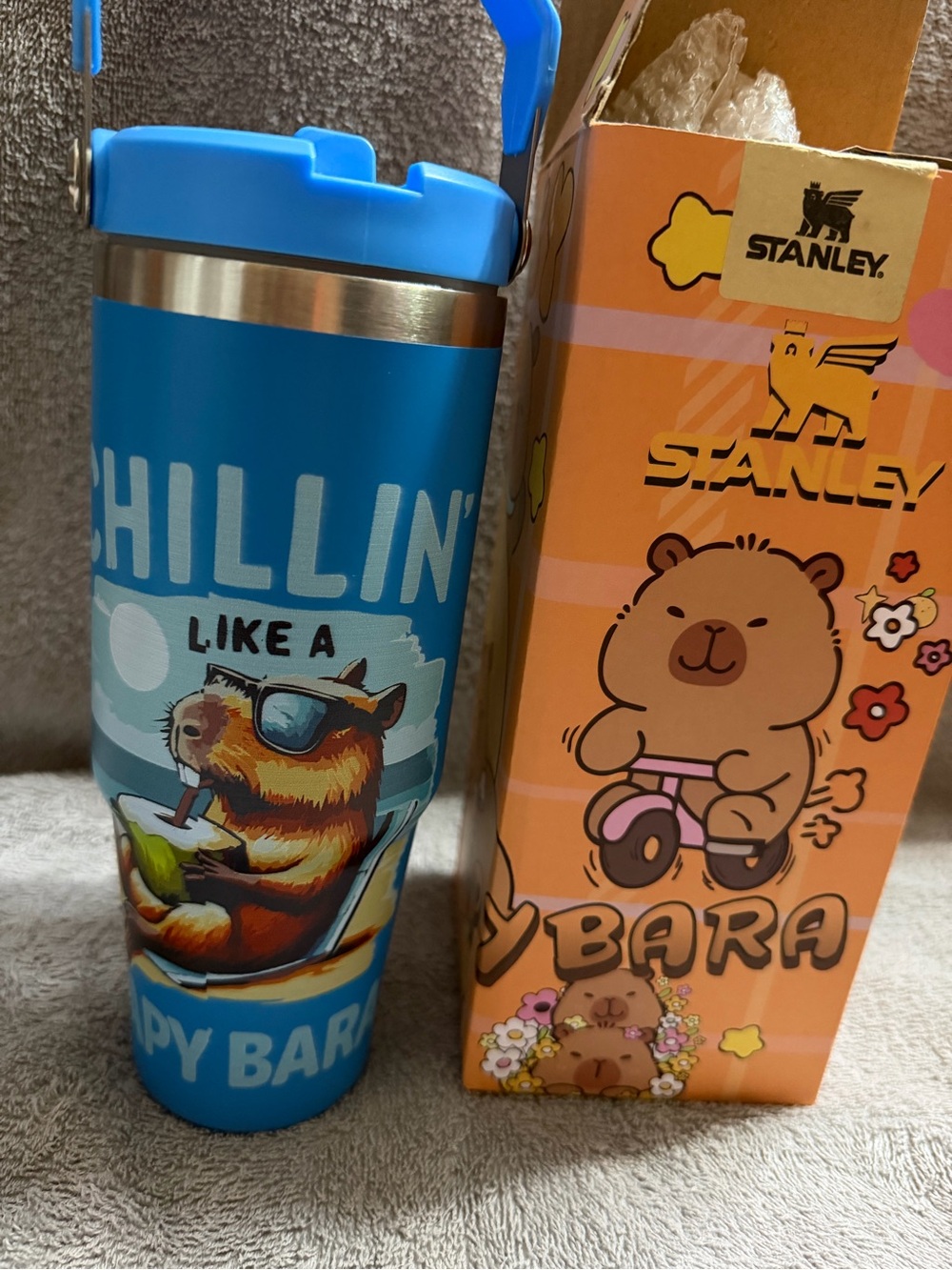 Stanley Blue Travel Tumbler with Playful Capybara Artwork